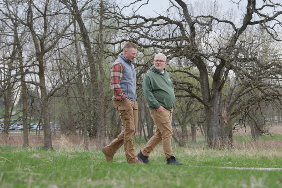 Tyler walking with another person.