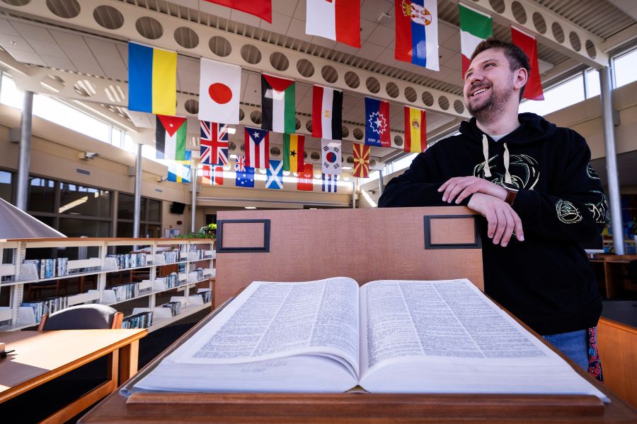 Cade looks ahead as he smiles. 