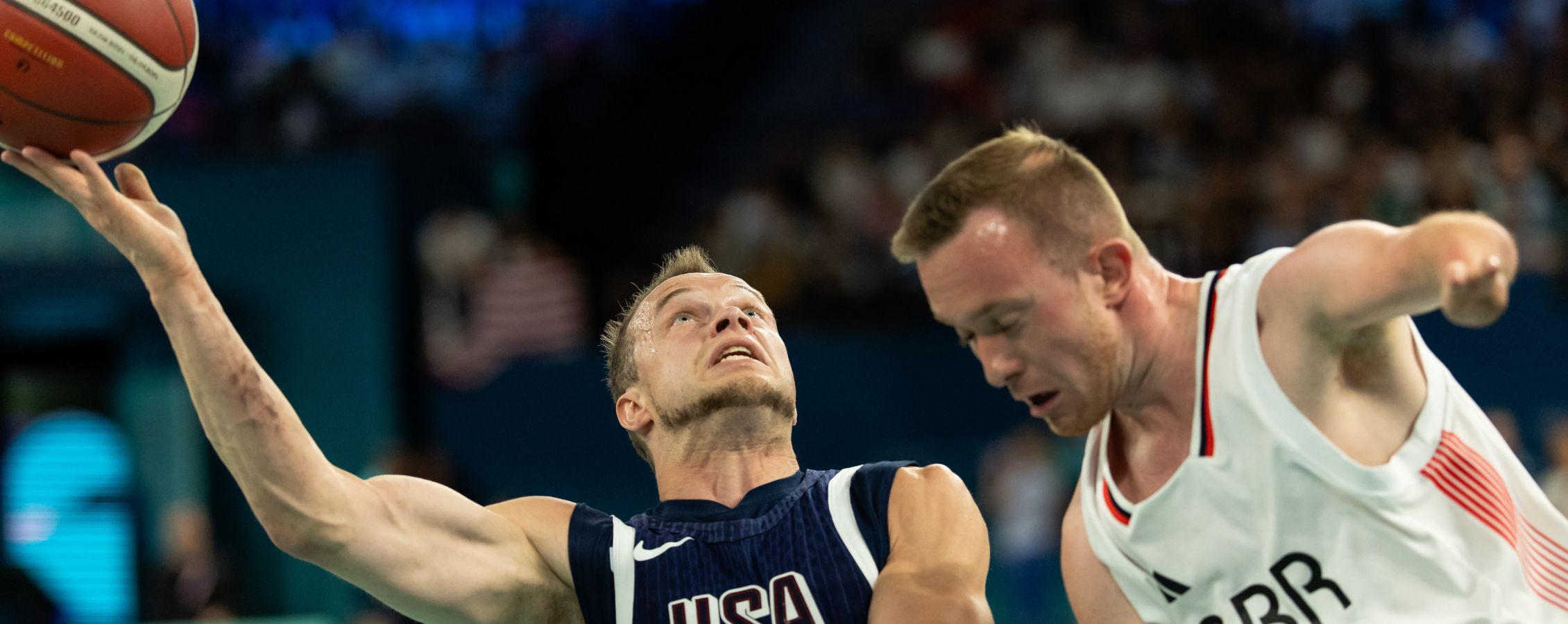 John Boie is about to shoot basketball in hoop.