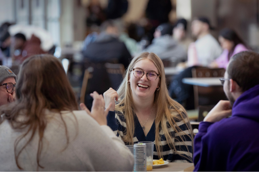 Lillian Groblewski, a communication sciences and disorders student from Lake Villa, Illinois, meets up with friends in the University Center on Monday, Jan. 27, 2025. (UW-Whitewater photo/Craig Schreiner).