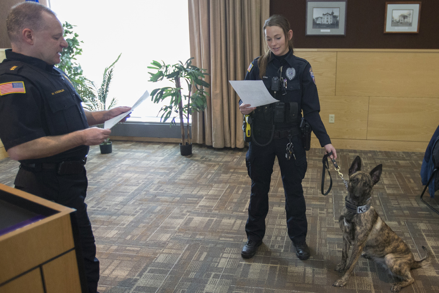 Lt. Servi and K9 Truss stand together in the University Center.