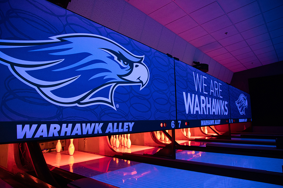 A picture of the bowling alleys in Warhawk Alley with the black lights on.