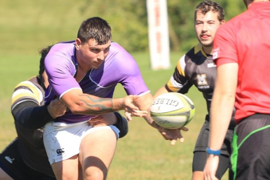 Myles Schumaker grabs for the ball.