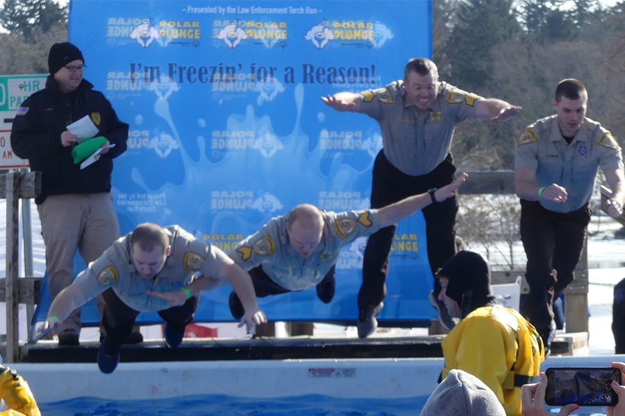 People jump in for th ePolar Plunge.
