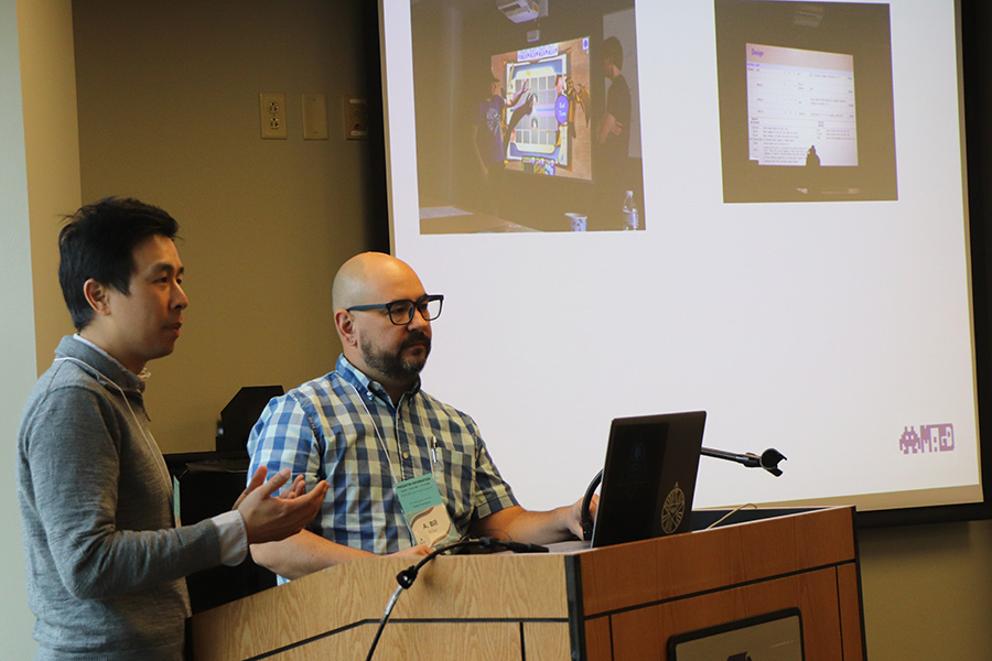 Two faculty members give a presentation.
