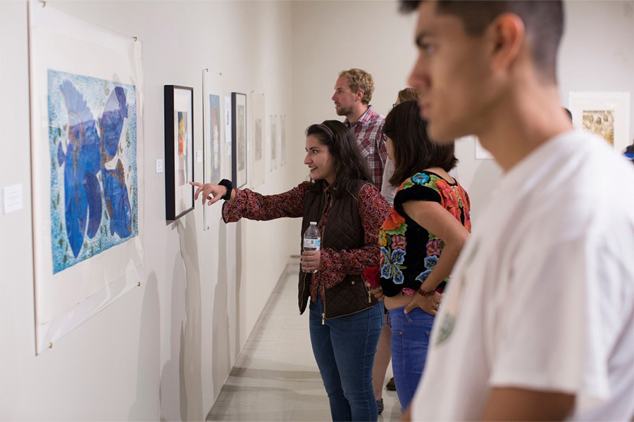 Students viewing art at gallery.