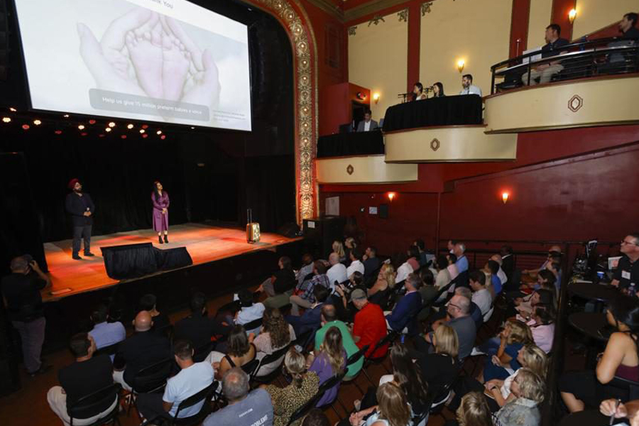 Photo of a full auditorium. 