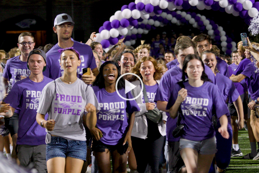 Image of students running during welcome week events.