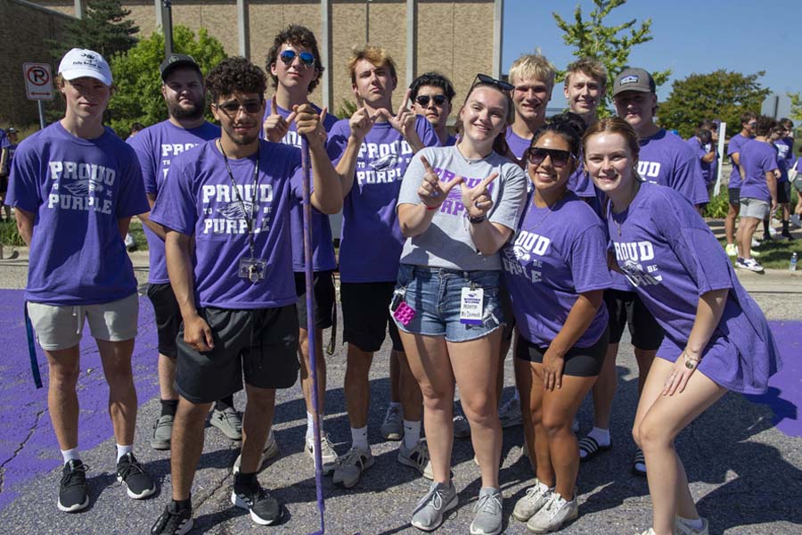 Students participate in paint it purple for welcome week.