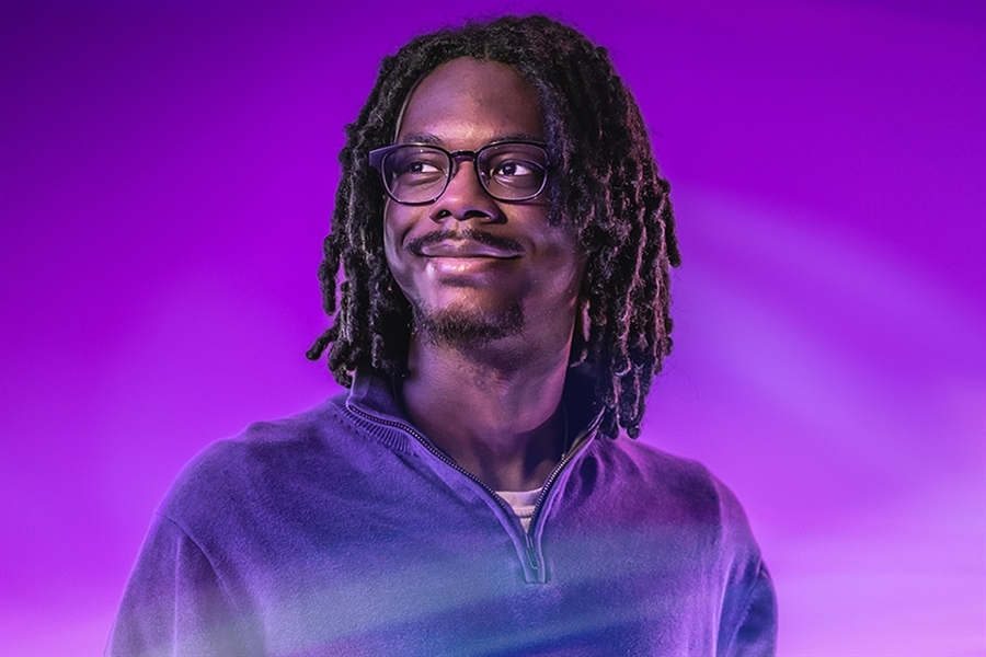 A person in purple lighting.