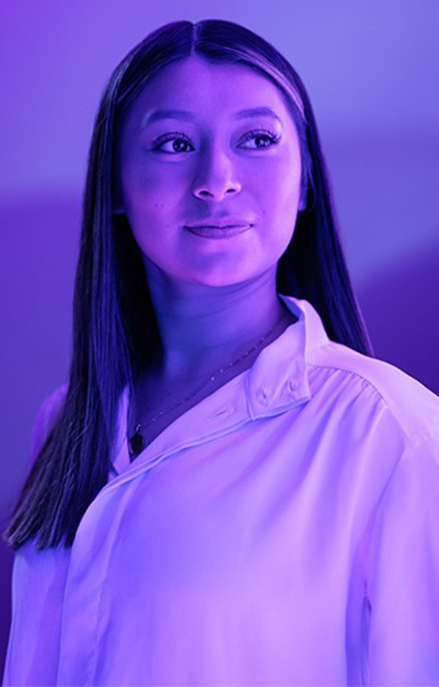 Young  woman poses for UW-Whitewater College of Business and Economics online 