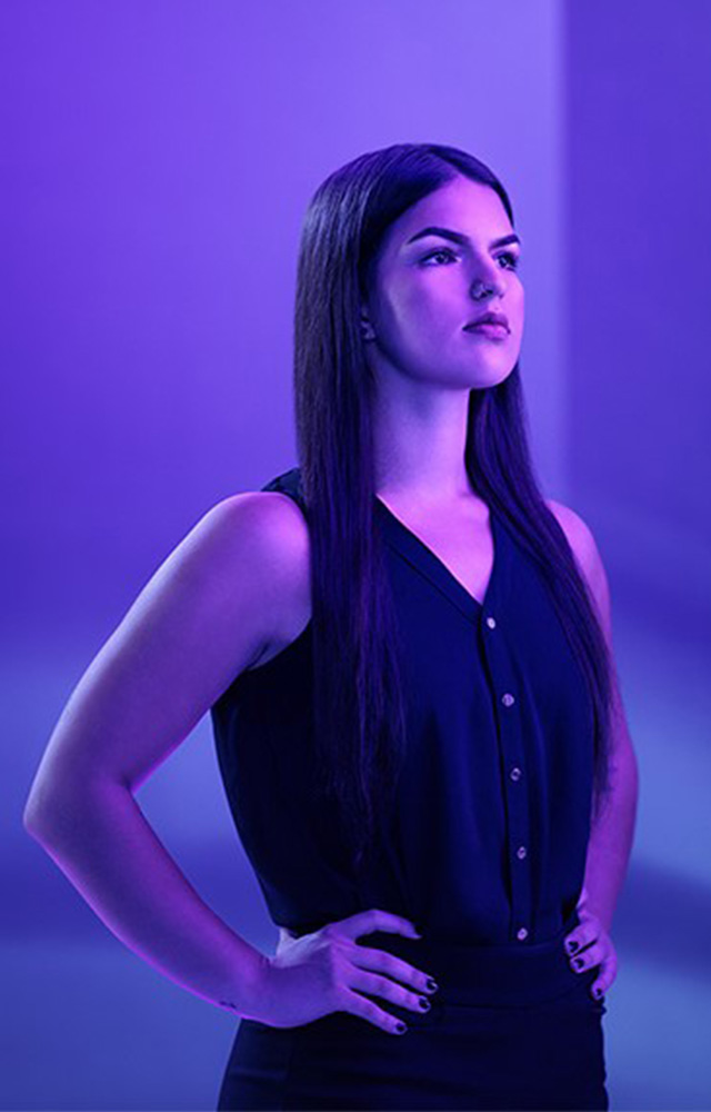 Young woman man poses for UW-Whitewater College of Business and Economics online 