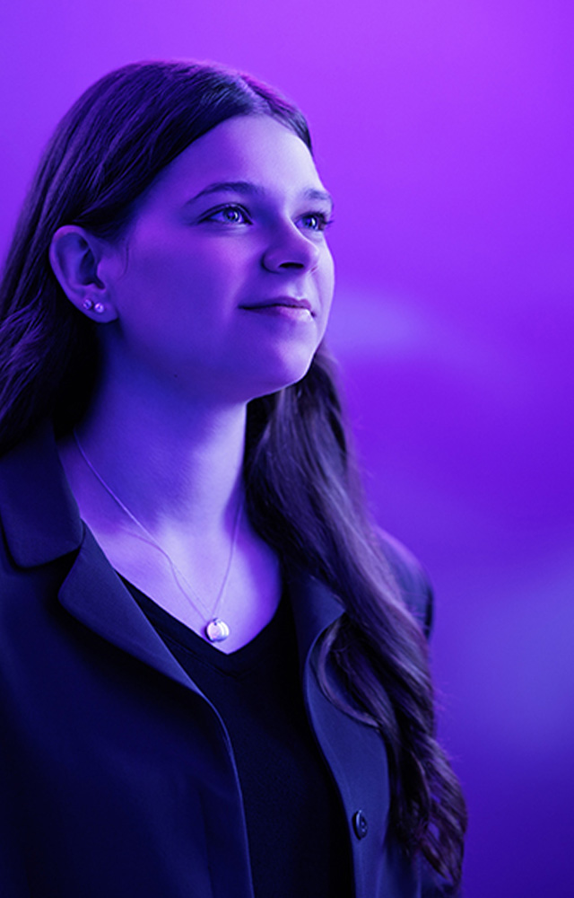 Claire Olsen, reading a book for her online class