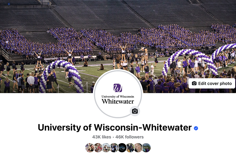 The UW-Whitewater Facebook page showing the university logo and a photo of students running on the football field under purple and white balloon arches.