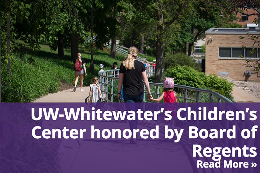 A student holds a child's hand as they walk together with a headline of UW-Whitewater's Children Center honored by Board of Regents.