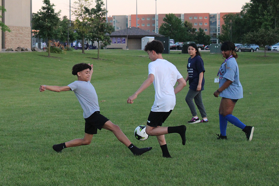 Boys playing soccer on the UW-Whitewater campus
