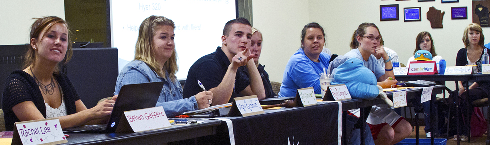 RHA members sitting at a desk