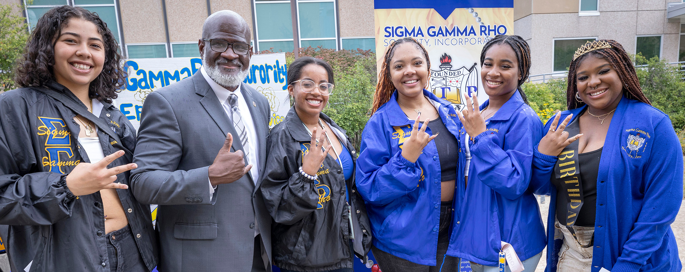 Group of sorority members smile while standing with Chancellor Corey King.