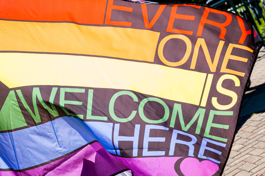 Image of a Pride Flag that states "Everyone is Welcome Here".