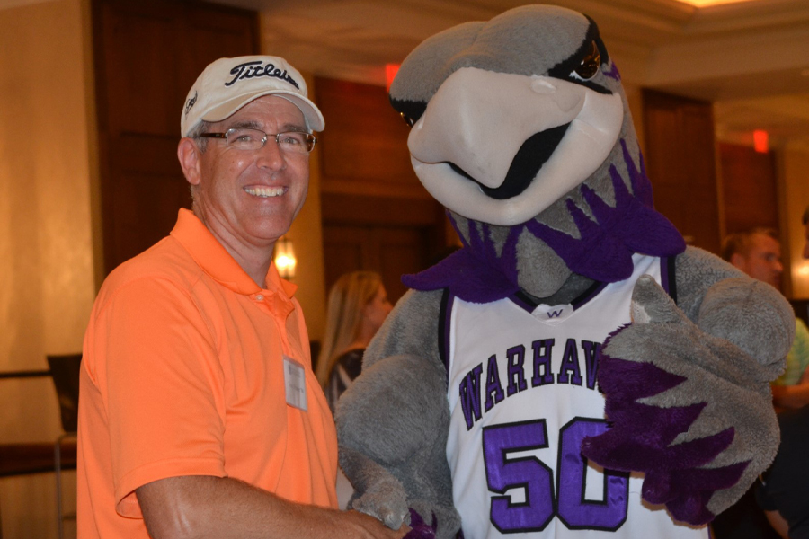 Anthony Prater shakes hands with Willie Warhawk.